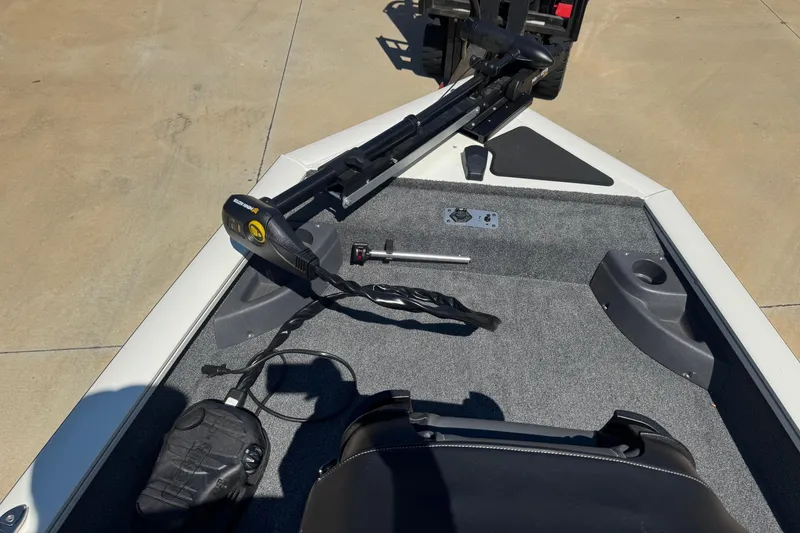 Slide: The Image of 2025 Bass Tracker Pro Team 170 boat interior with seating and steering console. - 6
