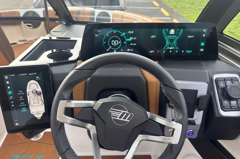 Slide: The Image of 2026 Malibu Wakesetter 21 LX dashboard with advanced digital displays and controls. - 17