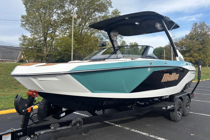 Slide: The Image of 2026 Malibu Wakesetter 21 LX boat on trailer, parked outdoors. - 8