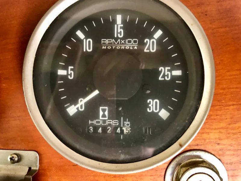 Slide: The Image of 1978 CHB 34 boat interior with wooden table and cushioned seating. - 14