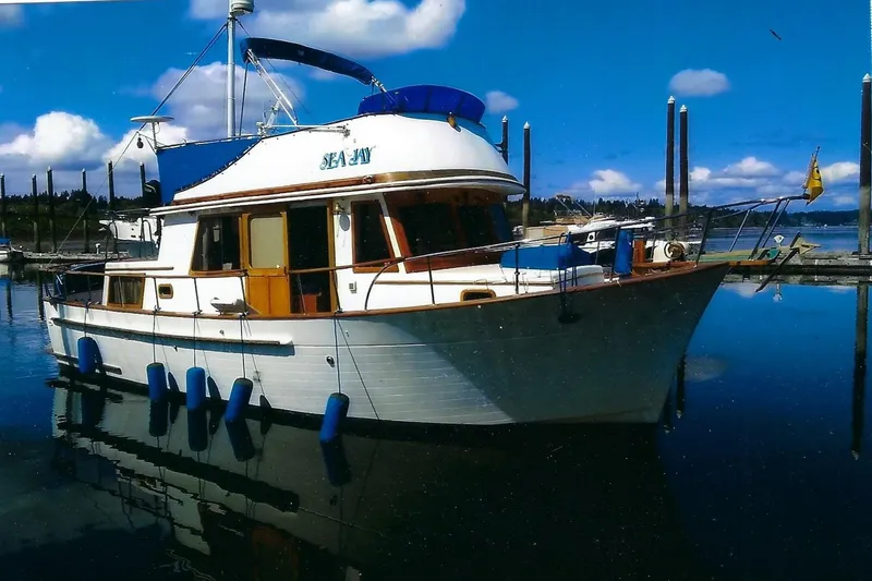 Slide: The Image of Cozy cabin interior of 1978 CHB 34 boat with wooden cabinetry and bed. - 18
