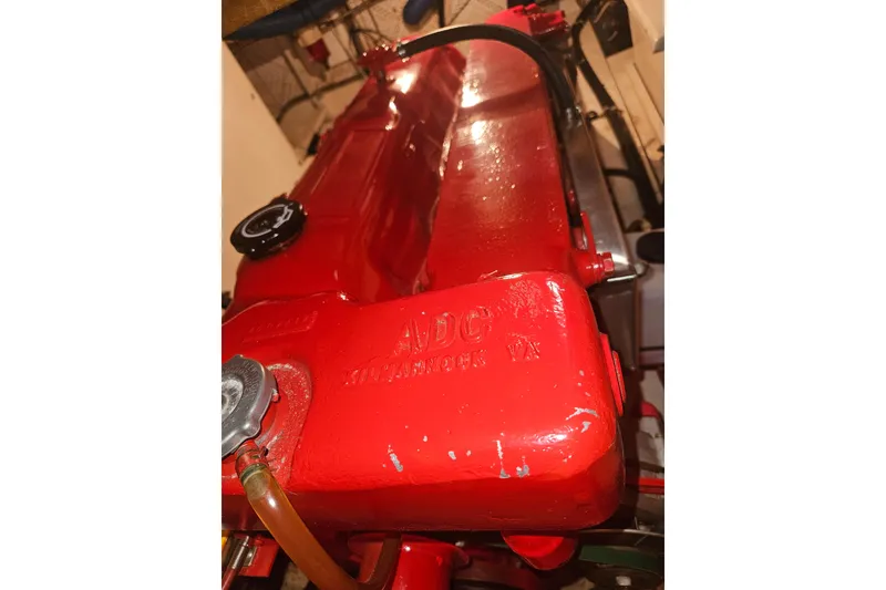 Slide: The Image of Red engine of a 1978 CHB 34 boat, showcasing detailed components. - 25