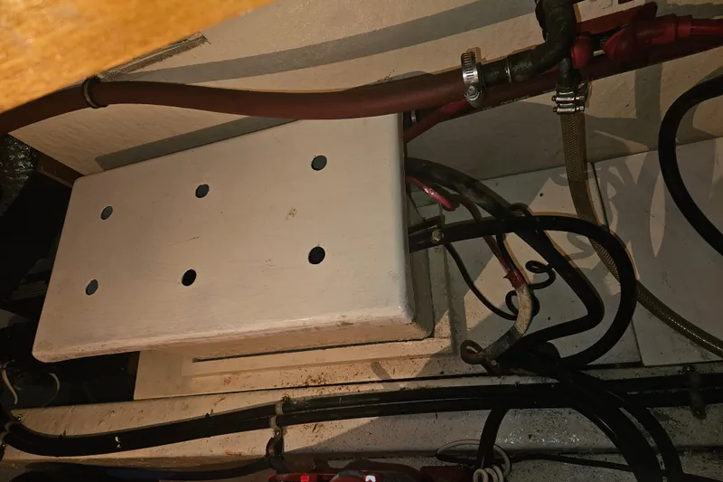 Slide: The Image of 1978 CHB 34 engine compartment with wiring and hoses visible. - 31