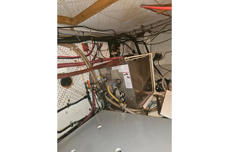 Slide: The Image of Engine room of a 1978 CHB 34 boat with wiring and equipment. - 32