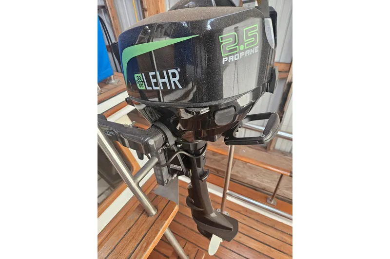 Slide: The Image of Lehr 2.5 propane outboard motor on CHB 34, 1978 model boat deck. - 34