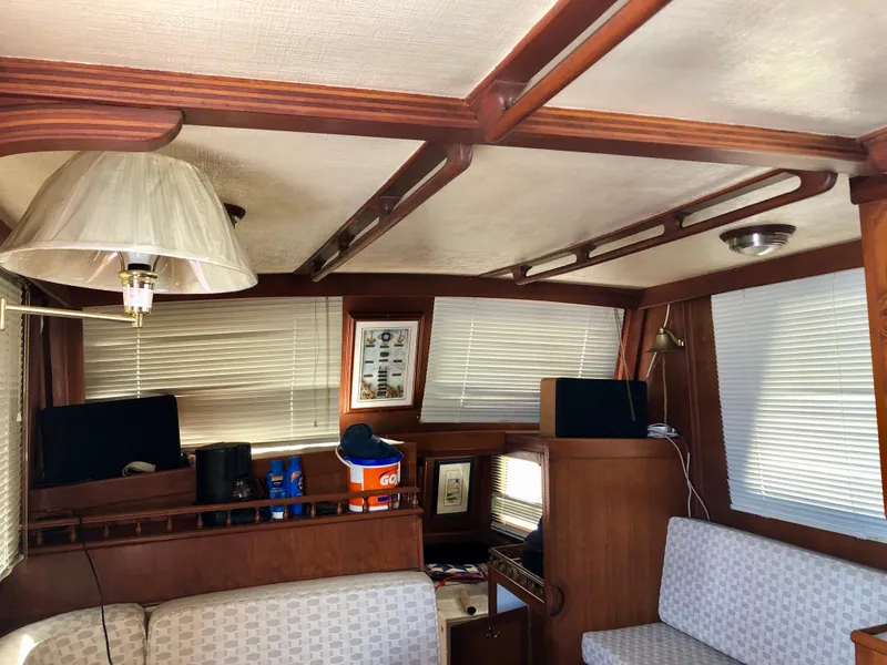 Slide: The Image of 1978 CHB 34 boat helm with wooden steering wheel and navigation equipment. - 6