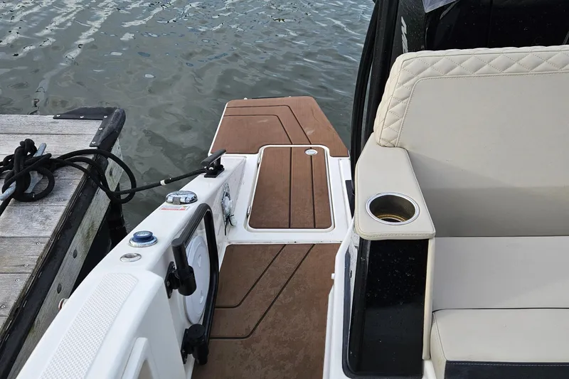 Slide: The Image of Twin Mercury 300 V8 engines on a 2025 Navan S30 boat at a marina. - 11