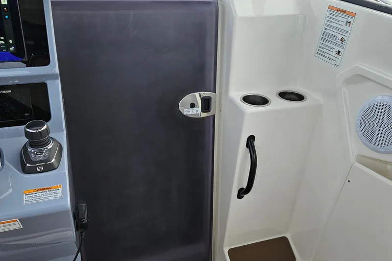 Slide: The Image of Black roof of 2025 Navan S30 boat with rod holders and skylights. - 7