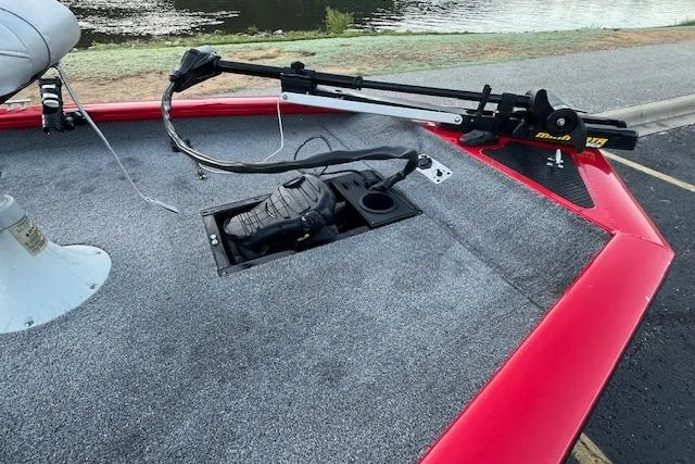 Slide: The Image of 2016 Tracker Pro Team 175 TXW boat seat on a calm lake. - 14