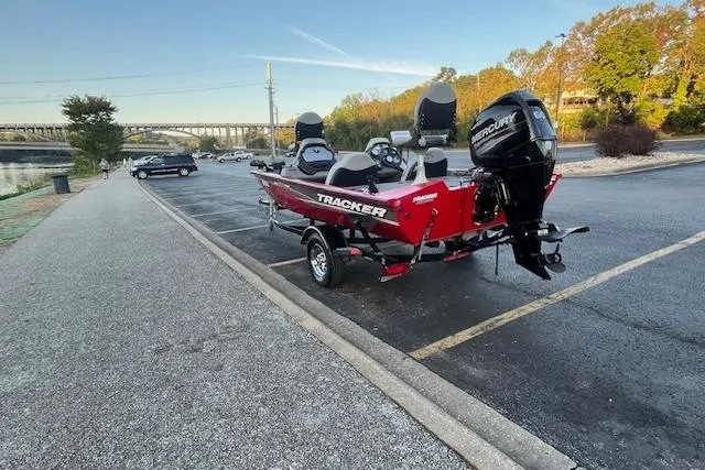 Slide: The Image of Boat seat on a 2016 Tracker Pro Team 175 TXW, with red hose nearby. - 17