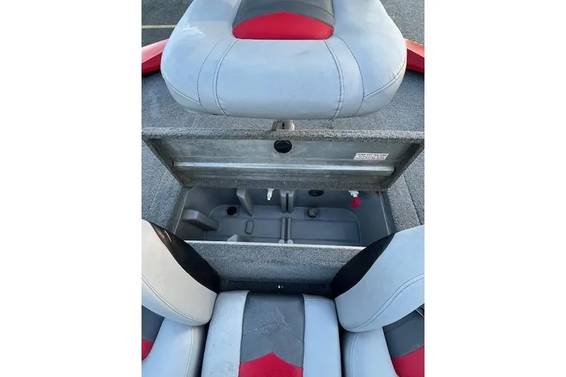 Slide: The Image of 2016 Tracker Pro Team 175 TXW boat storage compartment open, revealing interior details. - 23