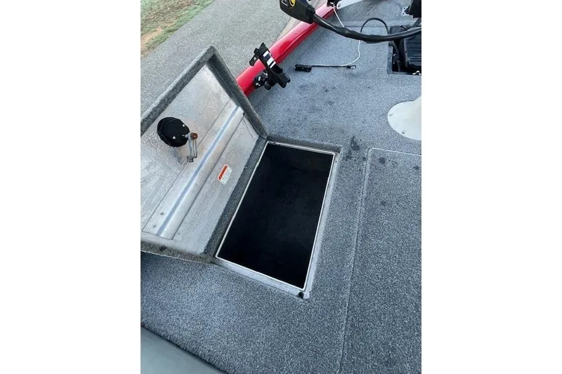Slide: The Image of Open storage compartment on 2016 Tracker Pro Team 175 TXW boat deck. - 25