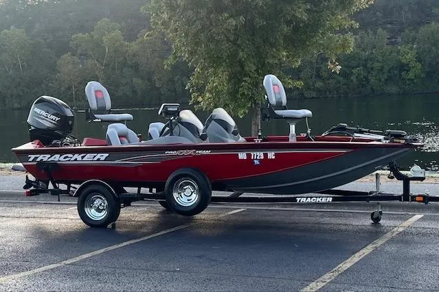 Slide: The Image of 2016 Tracker Pro Team 175 TXW boat on trailer by a lake. - 3