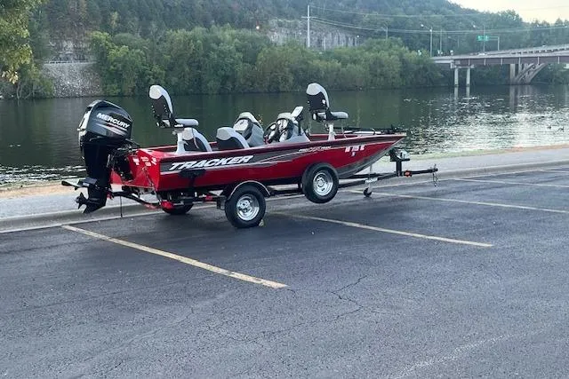 Slide: The Image of 2016 Tracker Pro Team 175 TXW boat on trailer, parked in a lot. - 6