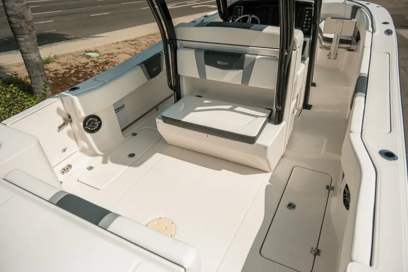 Slide: The Image of 2023 Robalo R270 Center Console boat interior with seating and storage compartments. - 10