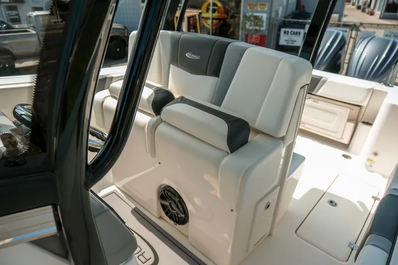 Slide: The Image of 2023 Robalo R270 Center Console boat interior with cushioned seating and modern design. - 15