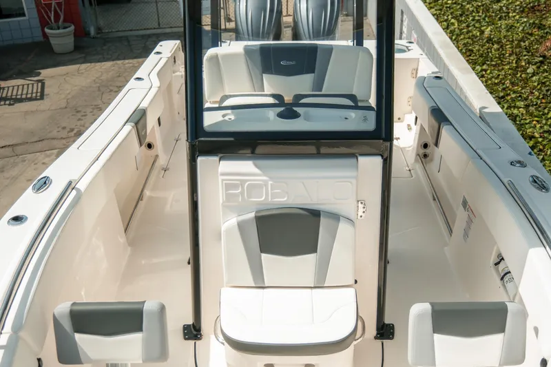 Slide: The Image of 2023 Robalo R270 Center Console boat interior with seating and console view. - 18