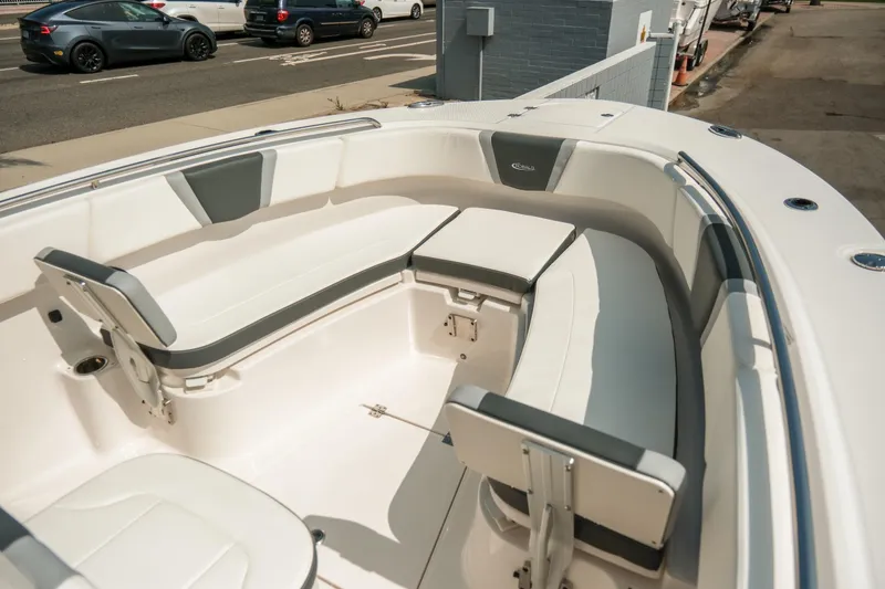 Slide: The Image of 2023 Robalo R270 Center Console boat with spacious seating and sleek design. - 22