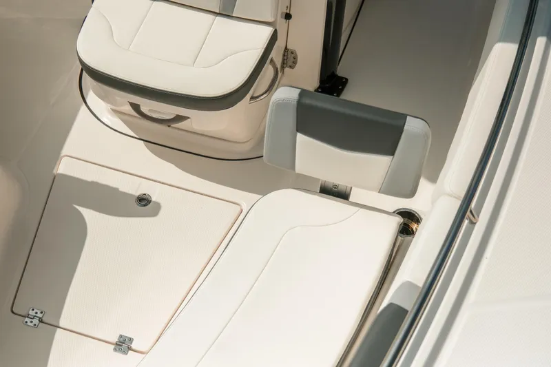 Slide: The Image of 2023 Robalo R270 Center Console boat seating and storage area, featuring sleek design and comfort. - 26