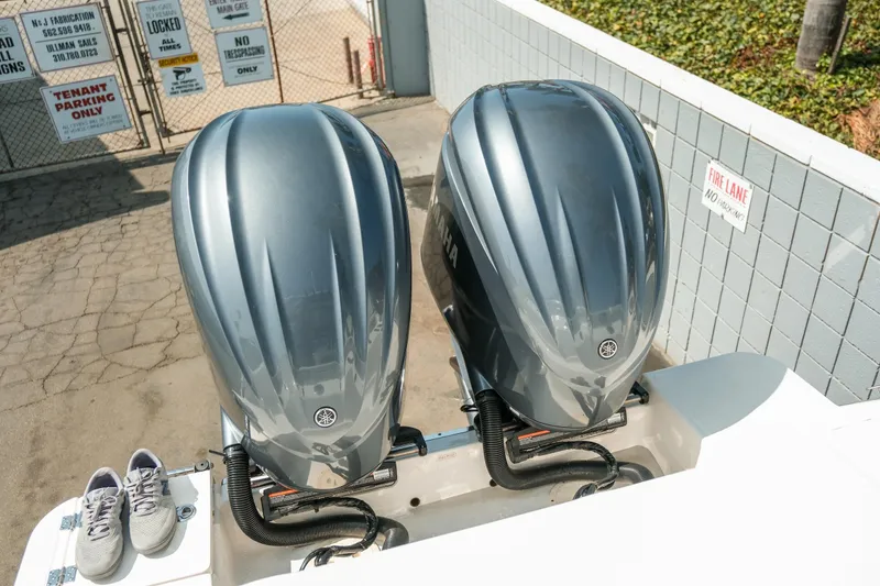 Slide: The Image of 2023 Robalo R270 Center Console with dual Yamaha outboard engines. - 33