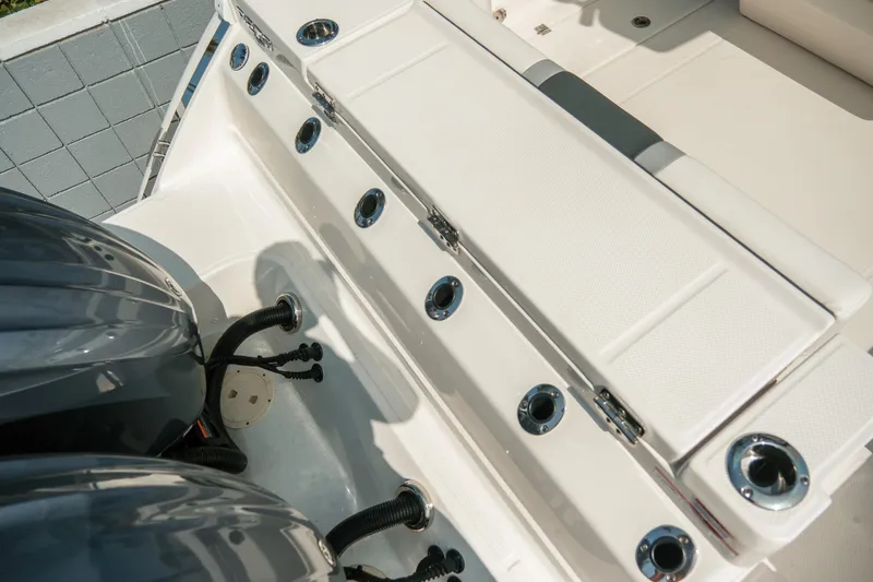 Slide: The Image of 2023 Robalo R270 Center Console boat with dual engines and sleek design. - 34