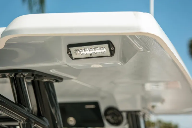 Slide: The Image of 2023 Robalo R270 Center Console boat with LED light detail. - 35