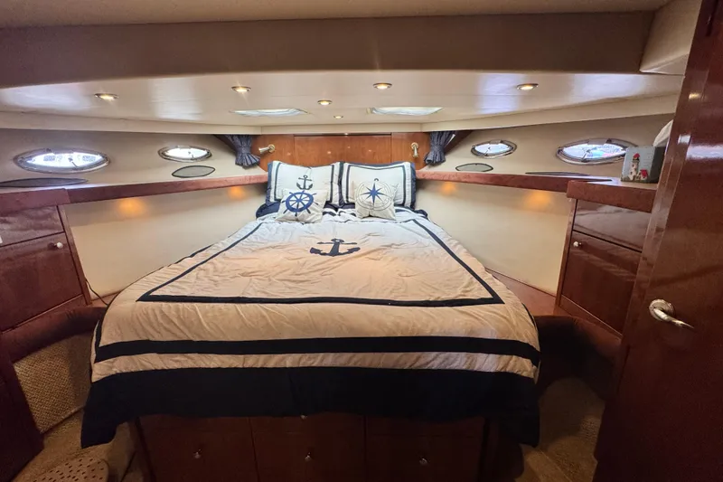 Slide: The Image of Luxurious cabin interior of 2006 Meridian 490 Pilothouse yacht with nautical bedding. - 10