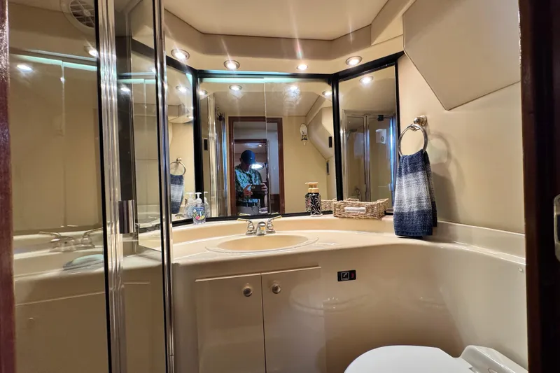 Slide: The Image of Luxurious bathroom in 2006 Meridian 490 Pilothouse yacht with modern fixtures and elegant design. - 11