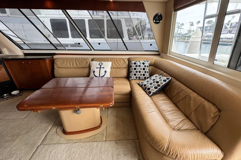 Slide: The Image of Luxurious interior of 2006 Meridian 490 Pilothouse yacht with leather seating and decorative pillows. - 16