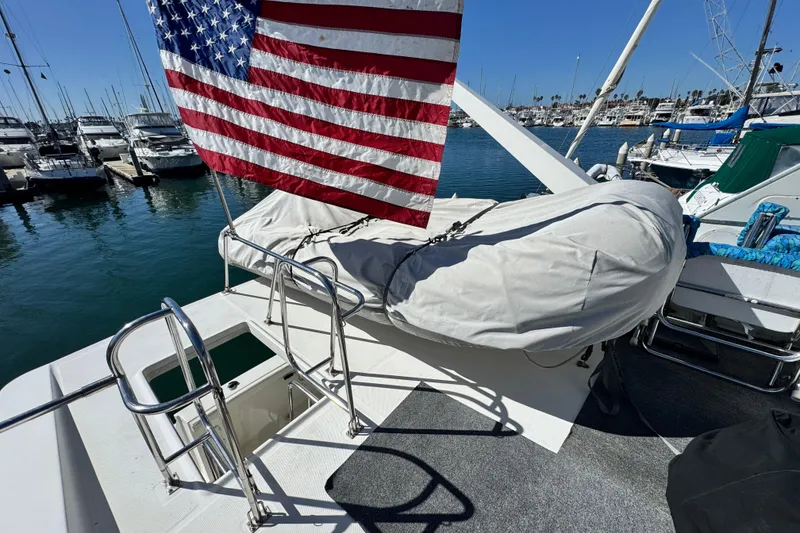 Slide: The Image of 2006 Meridian 490 Pilothouse yacht with American flag, docked in marina. - 29