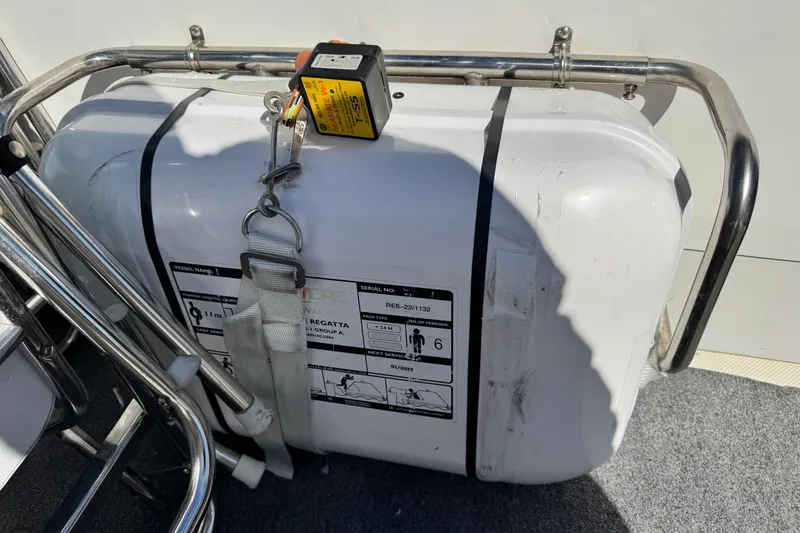 Slide: The Image of Life raft on 2006 Meridian 490 Pilothouse, secured with metal frame and straps. - 30