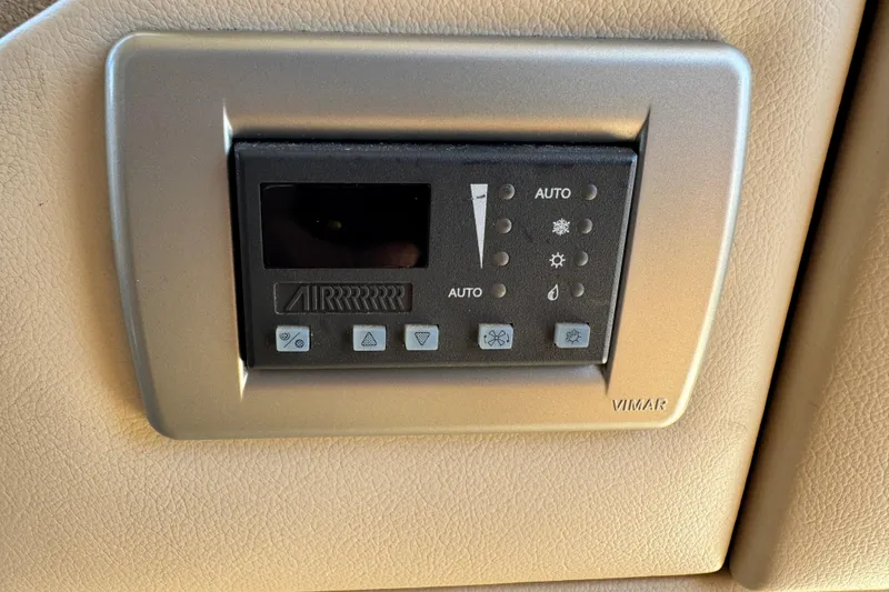 Slide: The Image of Control panel on a 2006 Meridian 490 Pilothouse yacht, featuring Vimar interface. - 35