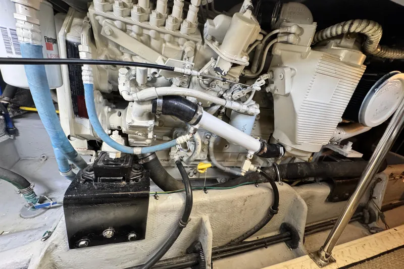 Slide: The Image of Engine compartment of a 2006 Meridian 490 Pilothouse yacht, showcasing mechanical components. - 38