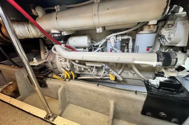 Slide: The Image of Engine compartment of a 2006 Meridian 490 Pilothouse yacht, showcasing mechanical components. - 39