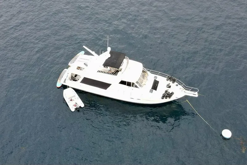 Slide: The Image of Aerial view of 2006 Meridian 490 Pilothouse yacht anchored in calm waters. - 41