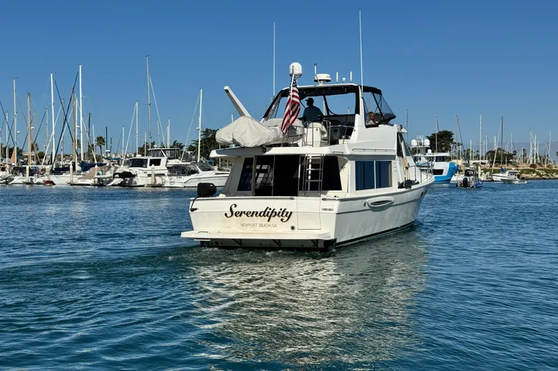 Slide: The Image of 2006 Meridian 490 Pilothouse yacht "Serendipity" in marina, Newport Beach, clear blue sky. - 6