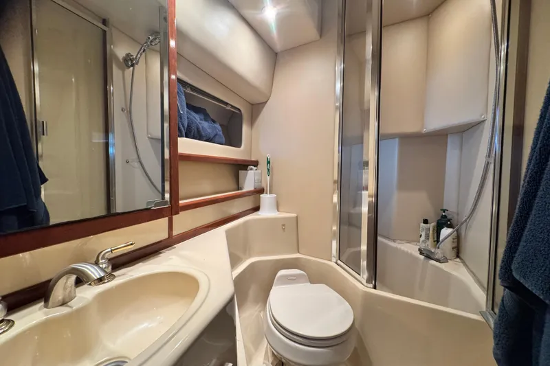 Slide: The Image of Luxurious bathroom in 2006 Meridian 490 Pilothouse yacht with modern fixtures and shower. - 8
