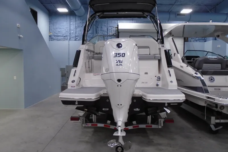 Slide: The Image of 2026 Regal 26 XO boat with powerful 350 V6 engine in showroom setting. - 4