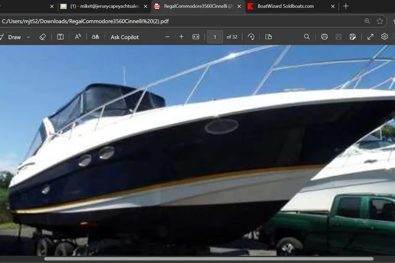 Slide: The Image of 2005 Regal Commodore 3560 IO boat on trailer, side view, outdoors. - 0