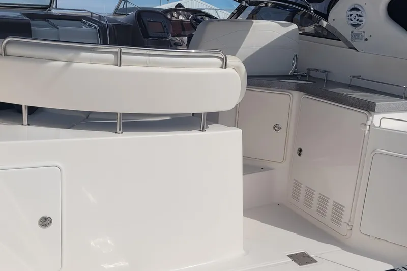Slide: The Image of 2005 Regal Commodore 3560 IO yacht interior with seating and kitchenette area. - 14