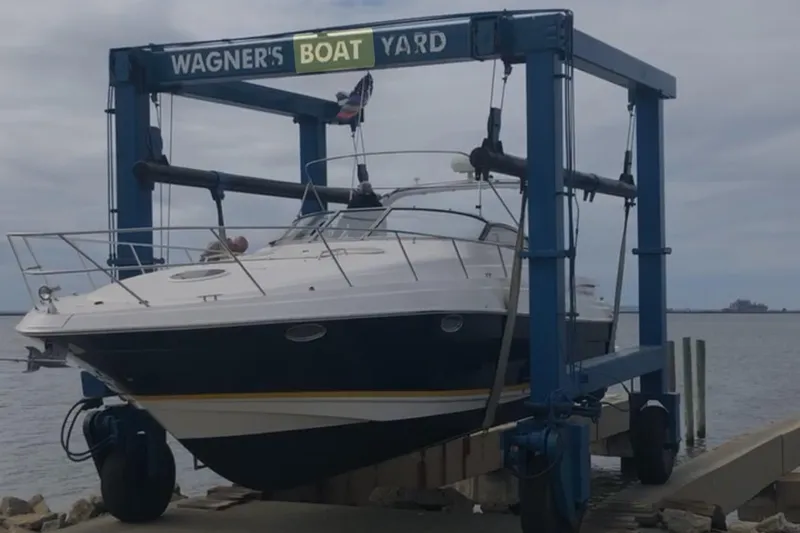 Slide: The Image of 2005 Regal Commodore 3560 IO boat at Wagner's Boat Yard lift. - 4