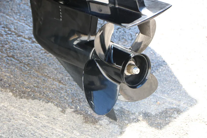 Slide: The Image of 2019 Tracker Pro Guide V-16 WT boat propeller on a wet surface. - 10