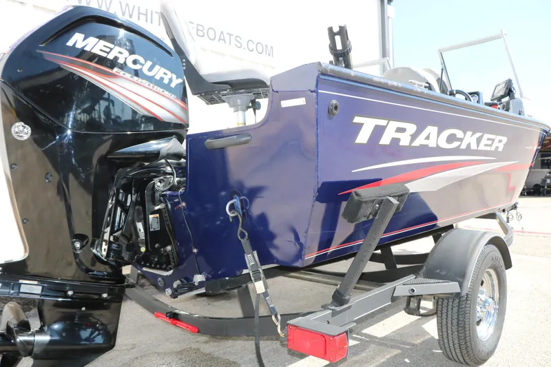 Slide: The Image of 2019 Tracker Pro Guide V-16 WT boat with Mercury outboard engine on trailer. - 12