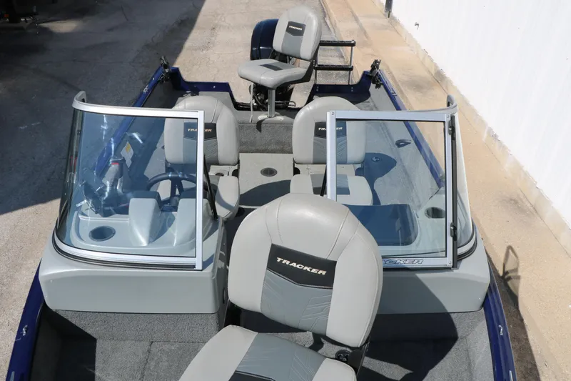 Slide: The Image of 2019 Tracker Pro Guide V-16 WT boat interior with seating and windshield. - 18