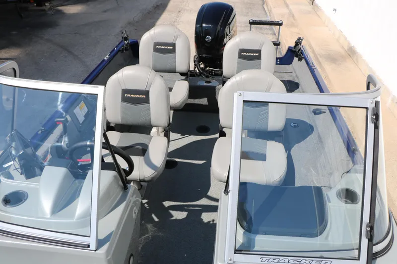 Slide: The Image of 2019 Tracker Pro Guide V-16 WT boat interior with seating and windshield. - 20