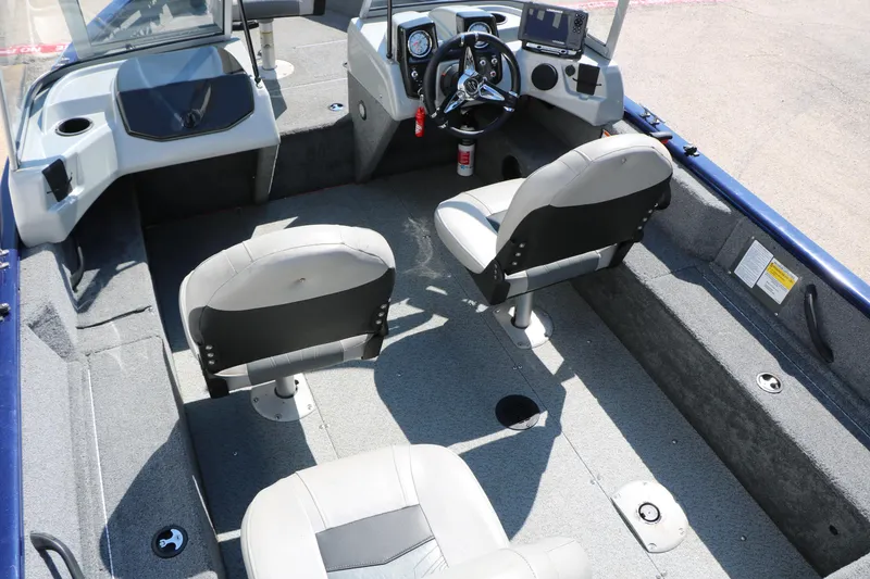 Slide: The Image of 2019 Tracker Pro Guide V-16 WT boat interior with seating and steering console. - 22
