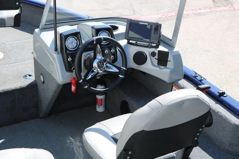 Slide: The Image of 2019 Tracker Pro Guide V-16 WT boat cockpit with steering wheel and navigation system. - 23