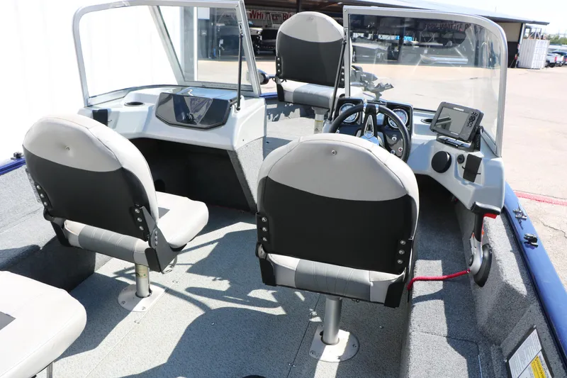 Slide: The Image of 2019 Tracker Pro Guide V-16 WT boat interior with dual seats and control panel. - 27