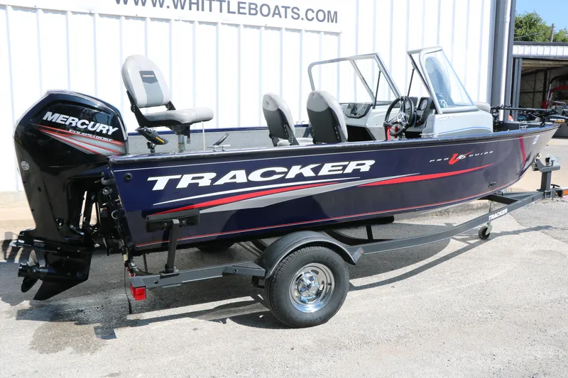 Slide: The Image of 2019 Tracker Pro Guide V-16 WT boat with Mercury outboard motor on trailer. - 3