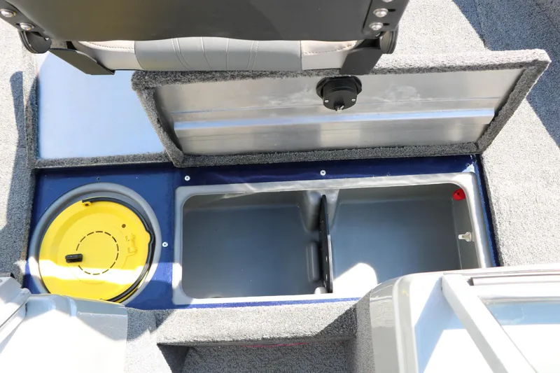 Slide: The Image of 2019 Tracker Pro Guide V-16 WT boat storage compartments with yellow lid and gray interior. - 32